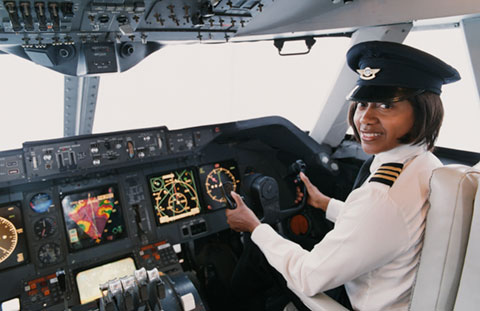 female pilot in cockpit Photo Credit Digital Vision