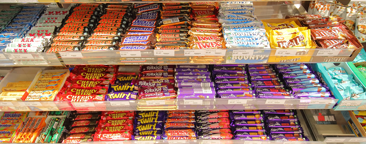 store shelves full of various chocolates