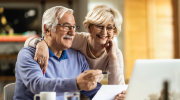 A smiling older couple. 