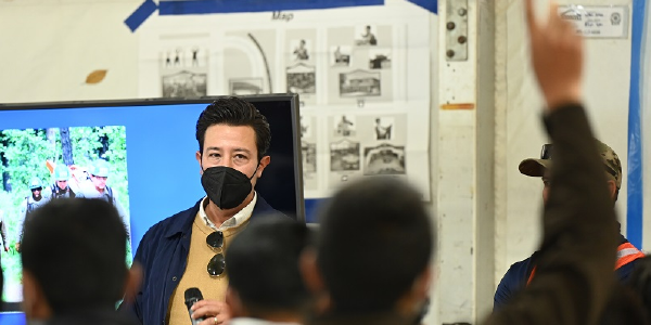 A Job Corps employee addresses Afghan evacuees at Holloman Air Force Base.