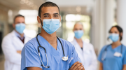 Healthcare workers in scrubs and surgical masks