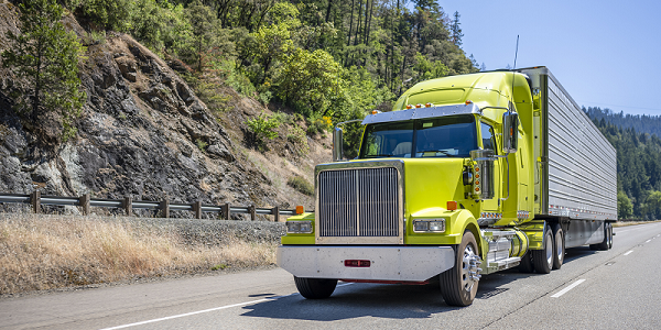 A truck driving on a highway. 