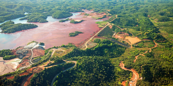 Mine tailings reservoir in Magadascar, receiving slurry through a pipeline from an ore processing plant. 