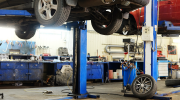 A vehicle lift in an auto shop. 