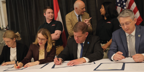 Secretary Walsh and Austrian Minister for Digital and Economic Affairs Dr. Margarete Schrambck sign an MOU.