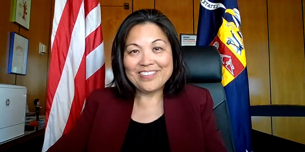 Screen grab of a video featuring Deputy Secretary Julie Su at her desk.