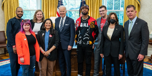 President Biden, Vice President Harris and Secretary Walsh stand with workers in the Oval Office