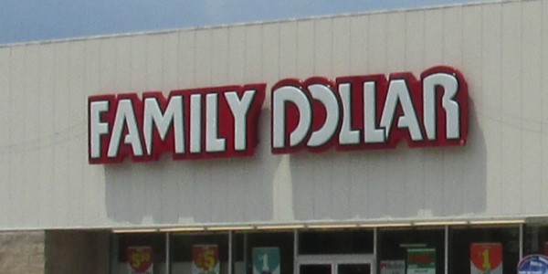 A large sign on a building reads, âFamily Dollar.â