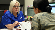 An employment counselor speaks with a service member.