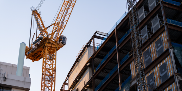 A construction crane rises above a building project in South Boston.