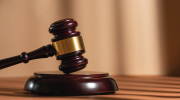 A judges gavel on a desk 