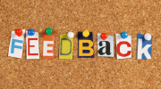 Cutout letters on a corkboard spell out the word âFeedback.â