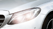 Close-up photo of a carâs headlight.