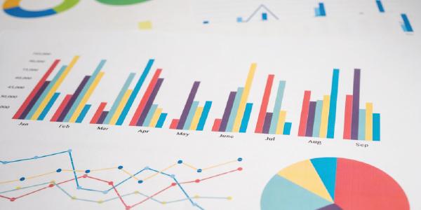 A printed sheet of colorful charts – including line graph, pie chart and bar chart.