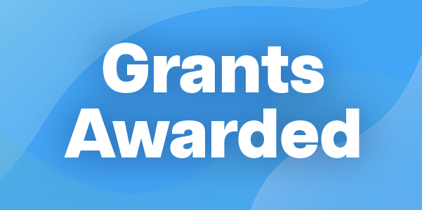 A graphic with an abstract blue background with white text reading “Grants Awarded.” 