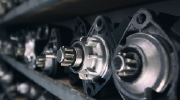 Close-up of metal auto parts in a factory production line. 