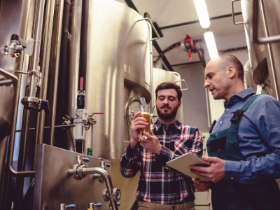 Two men working in a brewery