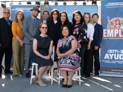 Men and women posing for a photograph