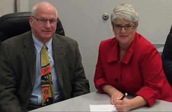 From left: TEJATC director David Wellington and OSHA Toledo Area Office Director Kim Nelson,  met on Jan. 8 to renew an alliance that protects and train workers on the job.