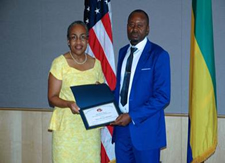 U.S. Ambassador to Gabon and Sao Tome and Principe Cynthia H. Akuetteh (left) presents the 2015 Iqbal Masih Award to prosecutor Alain-Georges Moukoko in Libreville, Gabon, June 12, 2015.