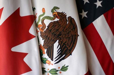 A close-up shot of the flags of Canada, Mexico, and the United States side by side.